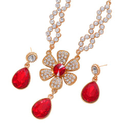 The two-piece set featuring flower elements with rhinestone inlays, earrings and necklace, highlights elegant charm.